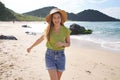 Brazilian girl dancing on empty beach. Carefree young healthy woman having fun on her summer holidays in Brazil Royalty Free Stock Photo