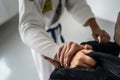 Brazilian Jiu Jitsu BJJ close up on hands and grip on the kimono gi during training or sparing martial arts concept