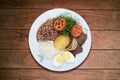 Brazilian lunch dish. Isolated on wooden background