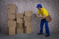 Brazilian mailman checking a lot of packages