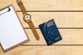 Brazilian Passport on the wooden table and itens for traveling