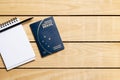 Brazilian Passport on the wooden table and itens for traveling