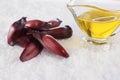 Brazilian Pinion fruit and olive oil in coarse salt background Royalty Free Stock Photo