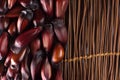 Brazilian Pinion fruit in wood background in the side of the frame seen from above Royalty Free Stock Photo