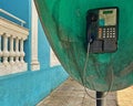 Brazilian public telephone on the sidewalk, poorly maintained