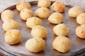 Brazilian snack cheese bread pao de queijo on oven-tray Royalty Free Stock Photo