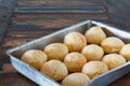 Brazilian snack cheese bread (pao de queijo) on oven-tray