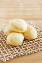 Brazilian snack cheese bread (pao de queijo) on wooden table Royalty Free Stock Photo