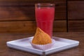 Brazilian snack called coxinha and juice on wood table Royalty Free Stock Photo