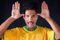 Brazilian Soccer Black Player Fan With Yellow Shirt Celebrating