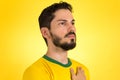 Brazilian soccer football player listening to the anthem and han Royalty Free Stock Photo