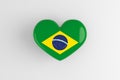 Brazilian souvenir - a badge in the shape of a heart with the flag of Brazil as a symbol of patriotism and pride in