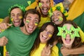 Brazilian sport soccer fans celebrating victory together.