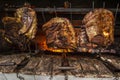 Brazilian style beef ribs Barbecue grill on skewers at a churrascaria steakhouse