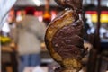 Brazilian style beef ribs Barbecue grill on skewers at a churrascaria steakhouse