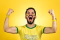 Brazilian supporter of National football team is celebrating, ch Royalty Free Stock Photo