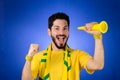 Brazilian supporter of National football team is celebrating, ch Royalty Free Stock Photo