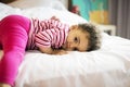 Brazilian toddler girl on bed
