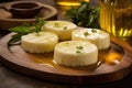 Brazilian traditional cheese Minas on wooden board with olive oil
