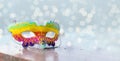 Brazilian or Venetian carnival.Bright multicolored mask on a bright shiny background with lights and bokeh.holiday.Carnival outfit Royalty Free Stock Photo