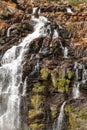 Waterfall with rocks and mosses Royalty Free Stock Photo