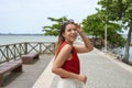 Brazilian woman turns around walking on Vitoria promenade, Espirito Santo, Brazil