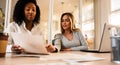 Brazilian woman explaining project details in the office Royalty Free Stock Photo