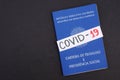 Brazilian Work Card carteira de trabalho with COVID-19 inscription. Concept of labor during Coronavirus quarantine.