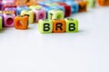 BRB text on colorful plastic alphabet beads representing Be Right Back. Taking a break concept Royalty Free Stock Photo