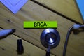 BRCA text on sticky notes and stethoscope on office desk. Heathcare/medical concept