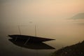 Breached boat at foggy dawn Royalty Free Stock Photo