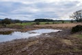 A breached flood bank on a wetland restoration project Royalty Free Stock Photo