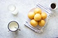 Breackfast with muffin, cup of coffe, cup of milk on light background, top view