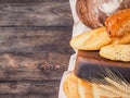 Bread assortment on brown wooden background Royalty Free Stock Photo