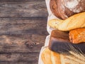 Bread assortment on brown wooden background Royalty Free Stock Photo