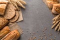 Bread background with wheat, aromatic crispbread with grains, copy space, top view. Brown and white whole grain loaves still life Royalty Free Stock Photo