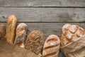 Bread bakery background. Brown and white wheat grain loaves composition on rustic wood Royalty Free Stock Photo