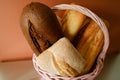 Baking products. Various loaves of bread in a wicker basket.