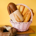 Bread Basket. Assorted Loafs Of Breads On Yellow Background. Baking Products.