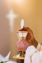 Hands of the pope celebrated the Eucharist with body and blood of christ