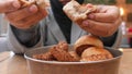 bread breaking on women hand