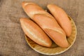 Bread and buns assortment / Fresh Bakery bread various types on plate with sack background / homemade breakfast food