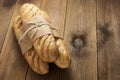 Bread buns baguettes on wooden table, rustic style. Pastry, breakfast, bread for sandwich isolated, copy space Royalty Free Stock Photo