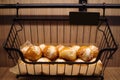 Bread buns in a black basket Royalty Free Stock Photo
