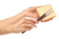 Bread with butter knife in hand Royalty Free Stock Photo
