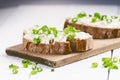 Bread with butter and spread. Concept of healthy breakfast. Spring onion, Vegetables. Wooden white table with copy space Royalty Free Stock Photo