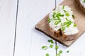 Bread with butter and spread. Concept of healthy breakfast. Spring onion, Vegetables. Wooden white table with copy space Royalty Free Stock Photo