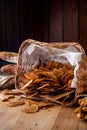 Bread chips. Basket with chips. Scattered crispy pastries. Chips in a wooden basket Royalty Free Stock Photo