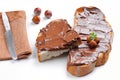Bread with chocolate cream and hazelnuts white isolated Royalty Free Stock Photo