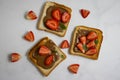 Bread with chocolate paste, strawberries on a light background Royalty Free Stock Photo